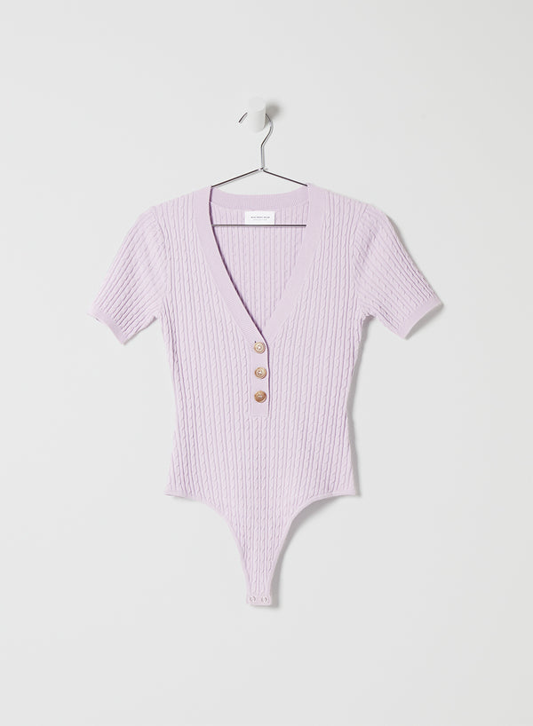 A light purple short-sleeved body suit with buttons and a V-line neck.