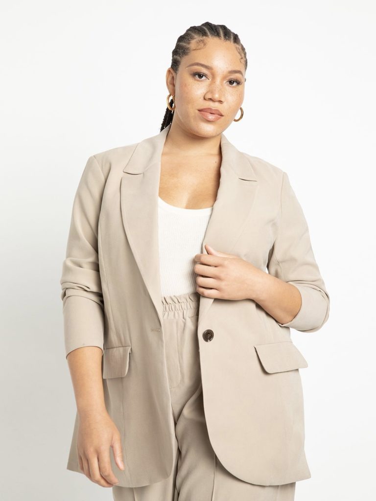 A pale sandy brown long-sleeved blazer.