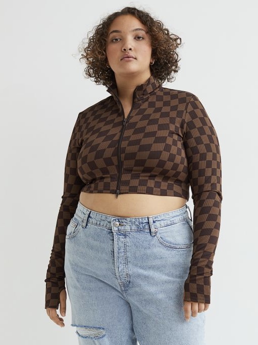 A brown checkered pattern long-sleeved crop top with a zipper.