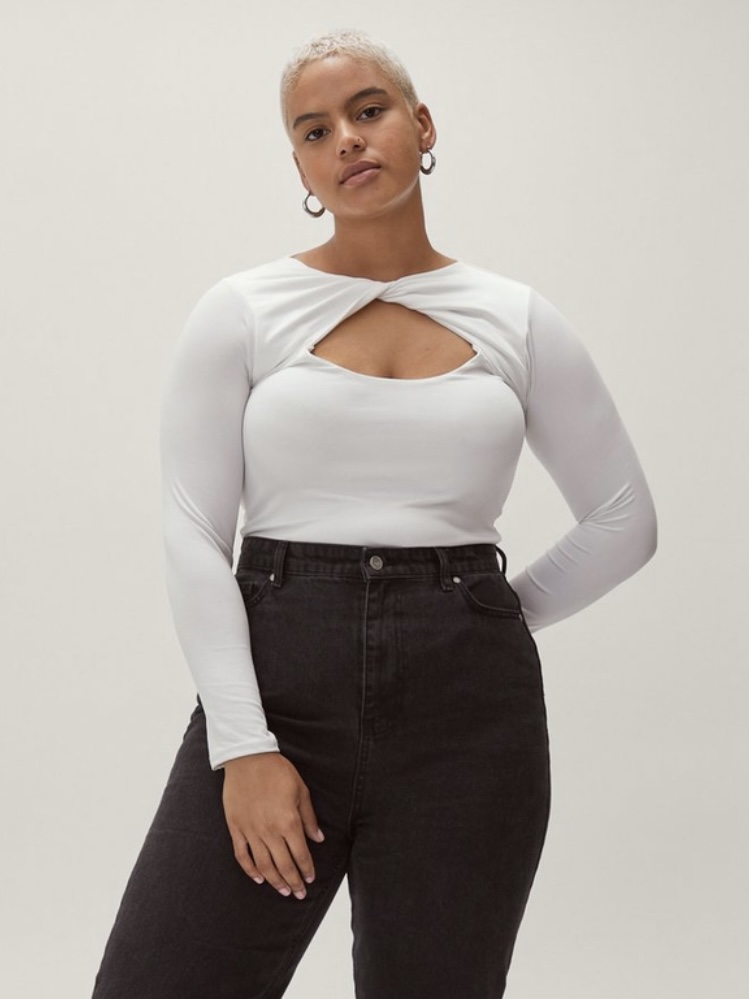 A white long-sleeved bodysuit with a chest cutout.