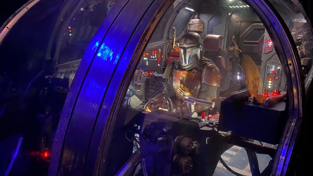 The Mandalorian and Grogu in a ship from the newest The Mandalorian third season teaser. The teaser was shown in the Mando+ Panel.