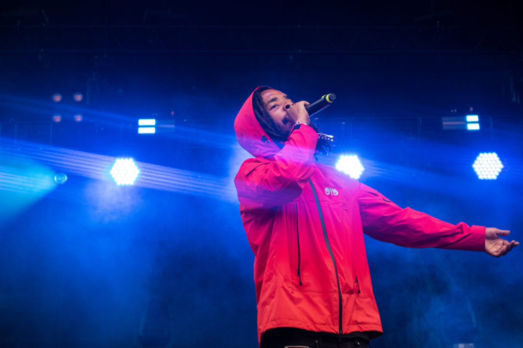 Left and right pictures: Earl Sweatshirt performing at the 2022 Pitchfork Music Festival.