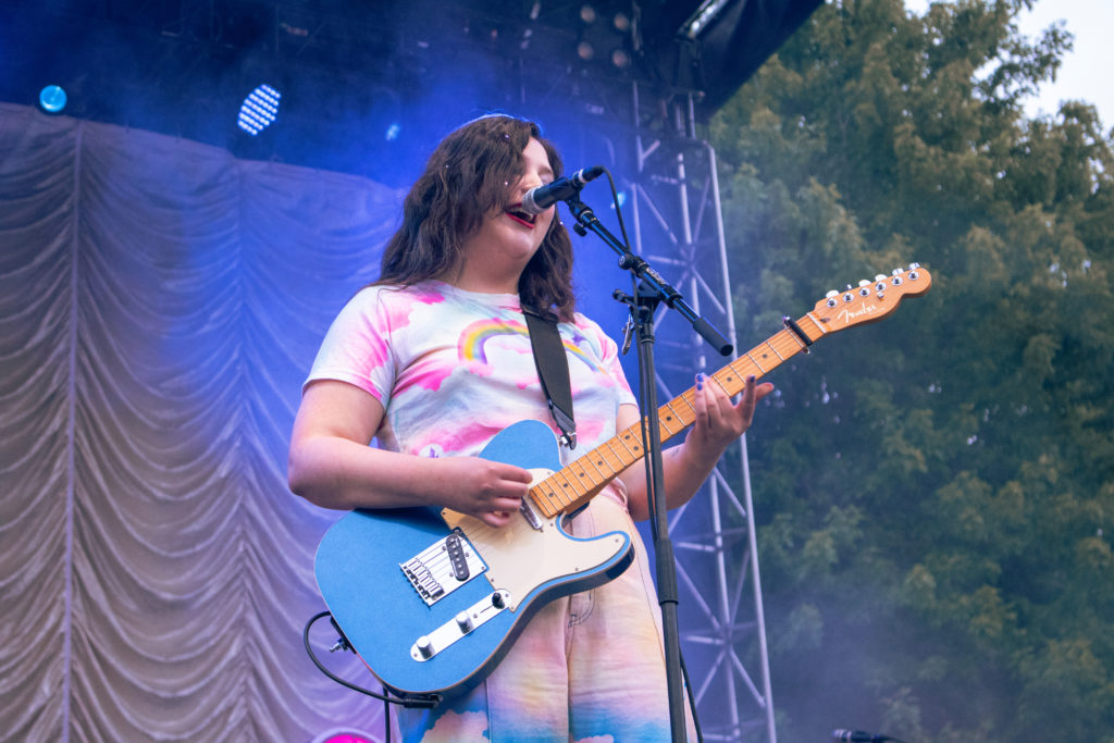 Left and right pictures: Lucy Dacus performing at the 2022 Pitchfork Music Festival.