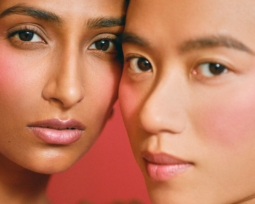 Kulfi Beauty - A close-up image of two people posing with their sides of heads touching each other.
